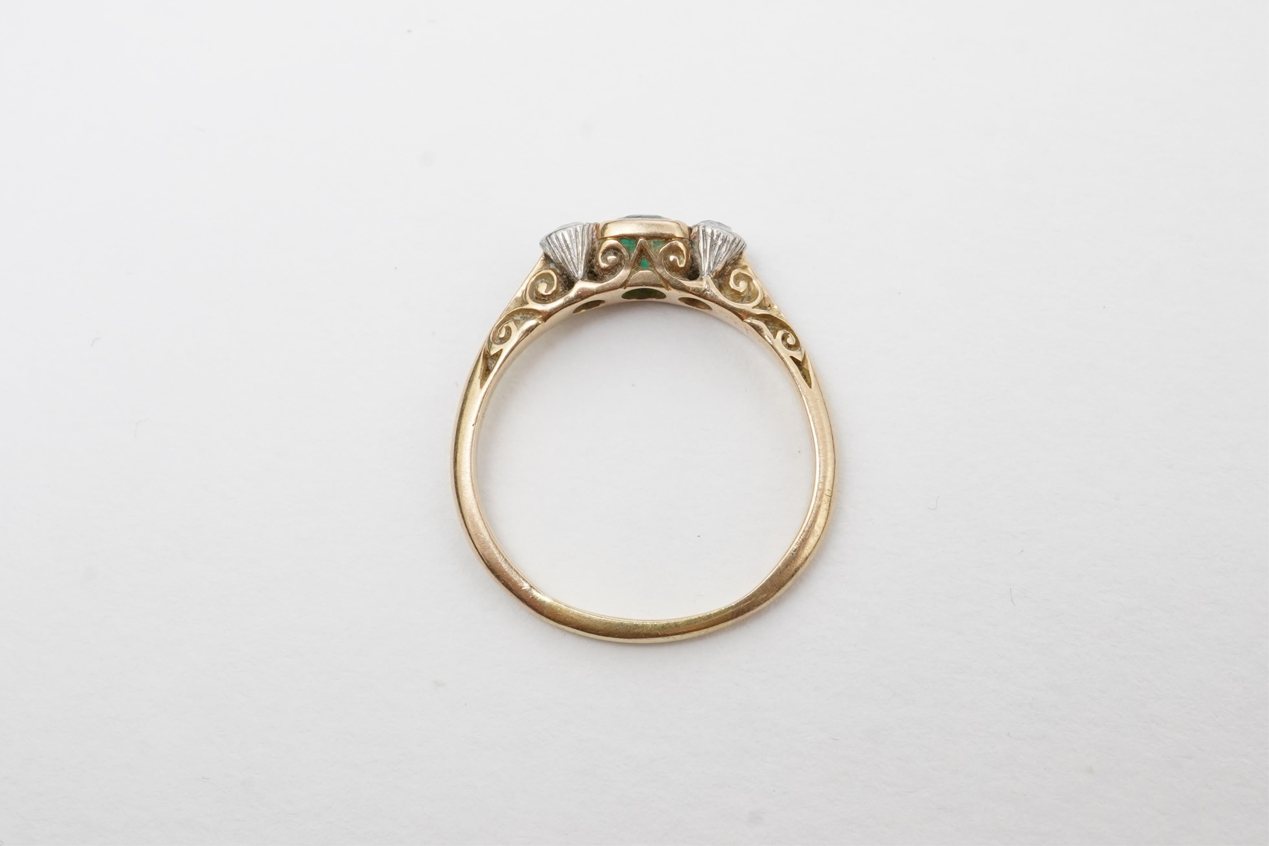 An emerald and diamond ring, early 20th century